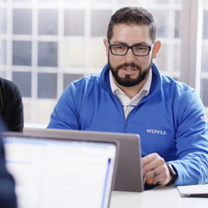 Two wipfli employees in a conference meeting