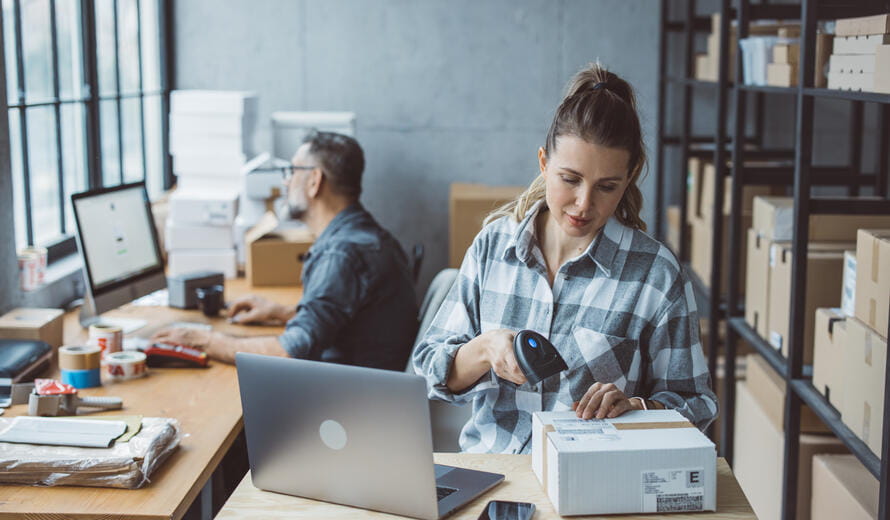 two people on a laptop