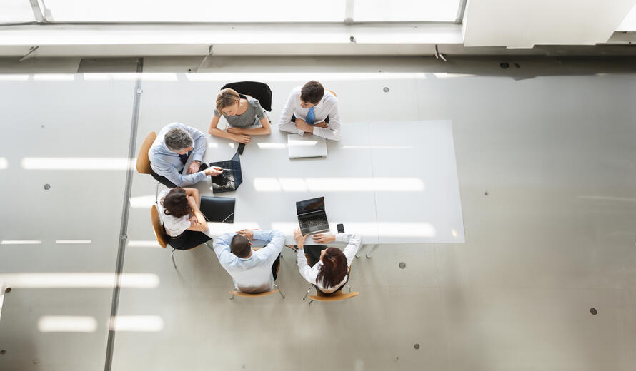 overhead view of people talking on the floor