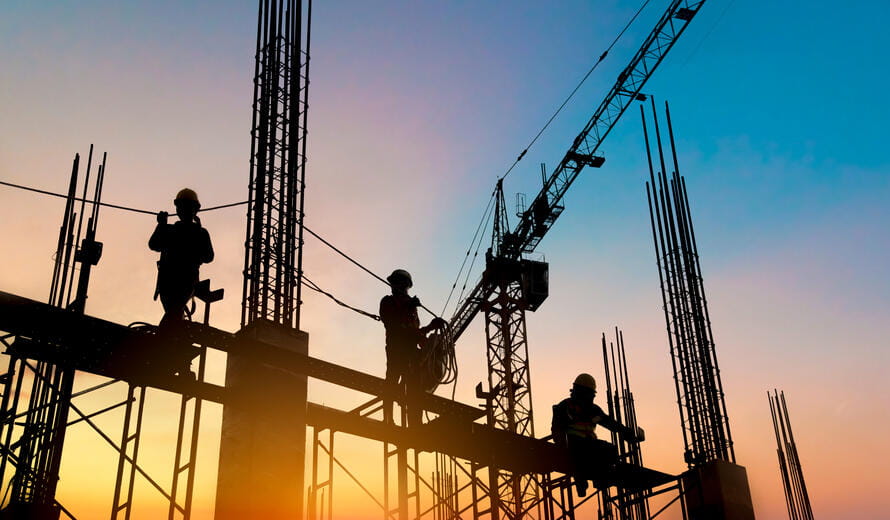 silhouette construction worker Concrete pouring during commercial concreting floors of building in construction site and Civil Engineer inspection work