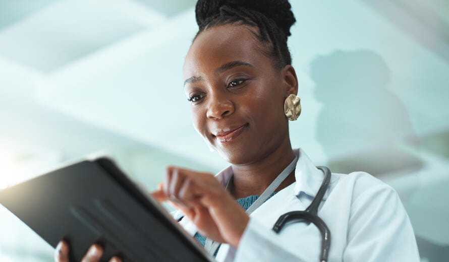 healthcare worker on a tablet